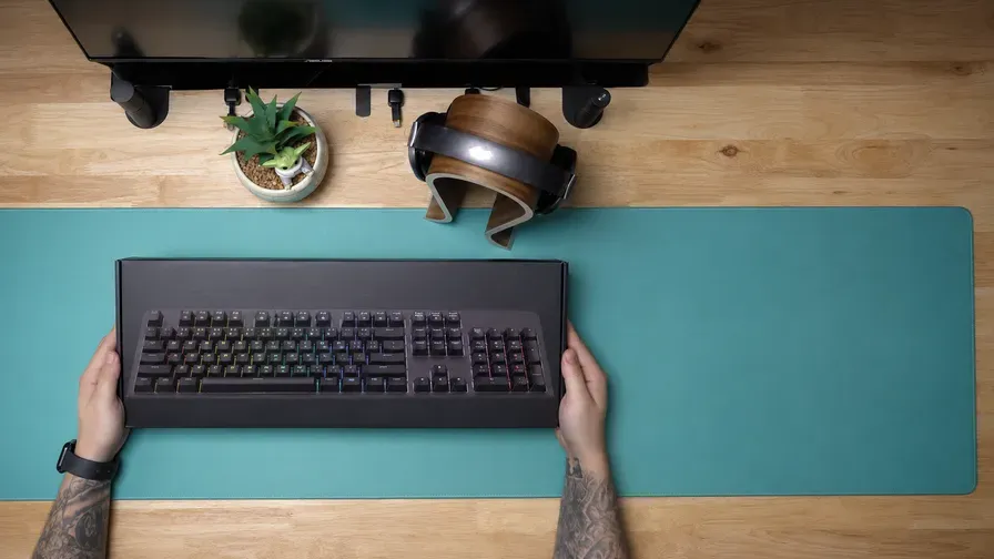 A mechanical keyboard on a desk, seen from above
