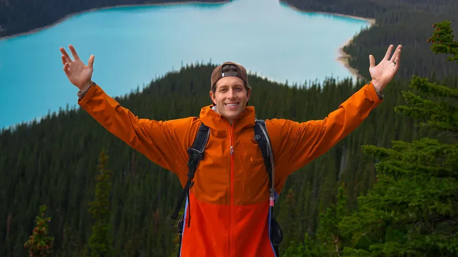 Kyle LaClaire above a glacial lake in the Rockies