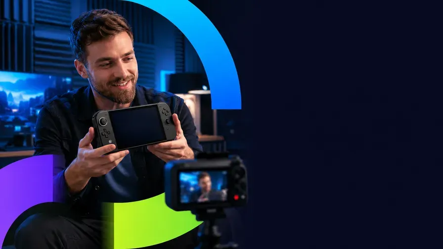 A creator showing a handheld console to camera