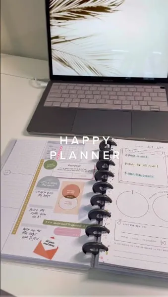 The Happy Planner appears in a recognizable desk setting. Show where the product fits into everyday use.