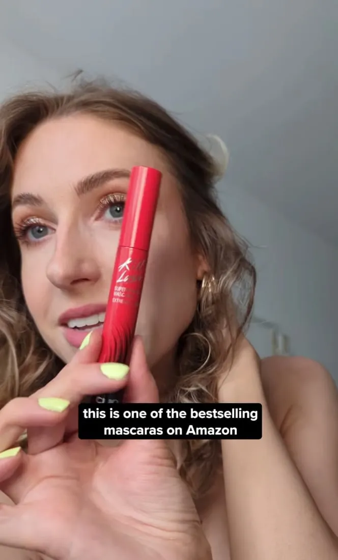 A creator holds CLIO mascara beside on-screen Amazon messaging.