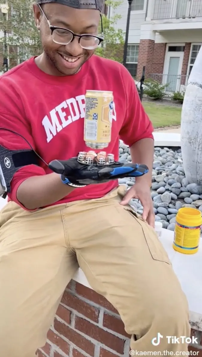 A creator demonstrates a gloved-hand project in a TikTok still from the NVIDIA campaign.