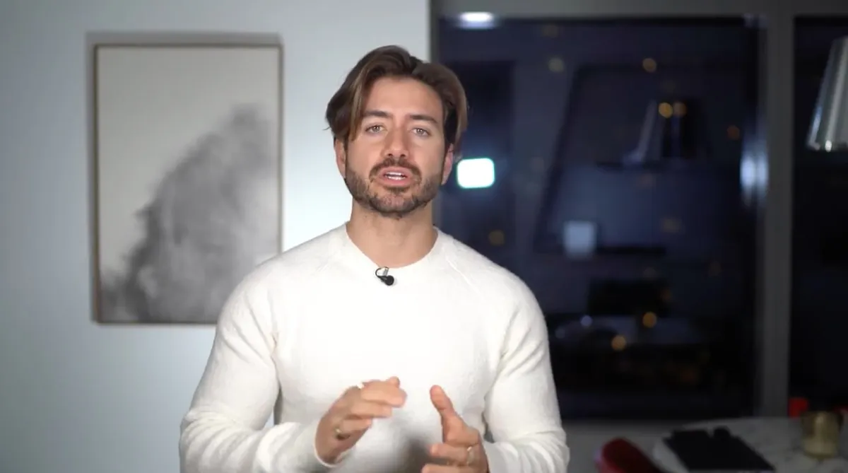 Creator wearing a lapel microphone explaining a topic to camera