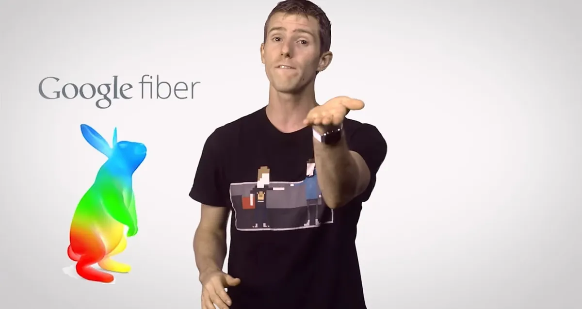 Tech creator presenting Google Fiber on camera, with the Google Fiber logo beside him