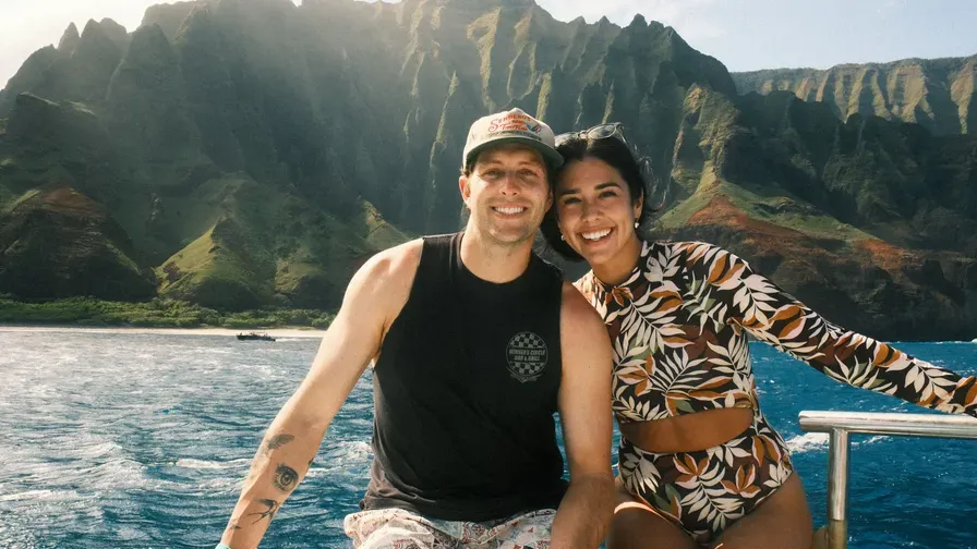 Kristin and Kyle LaClaire on a boat along the Hawaiian coast