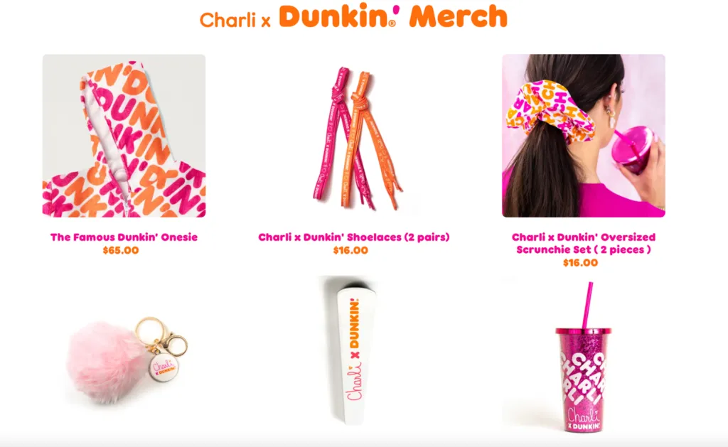 Charli x Dunkin' merch lineup with branded onesie, shoelaces, scrunchie set, pom keychain and iced-coffee tumbler