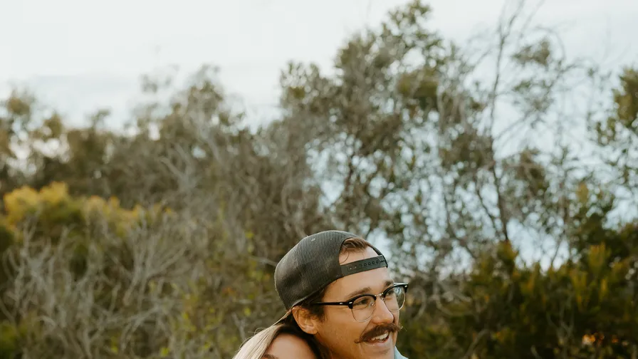 Two creators laughing outdoors