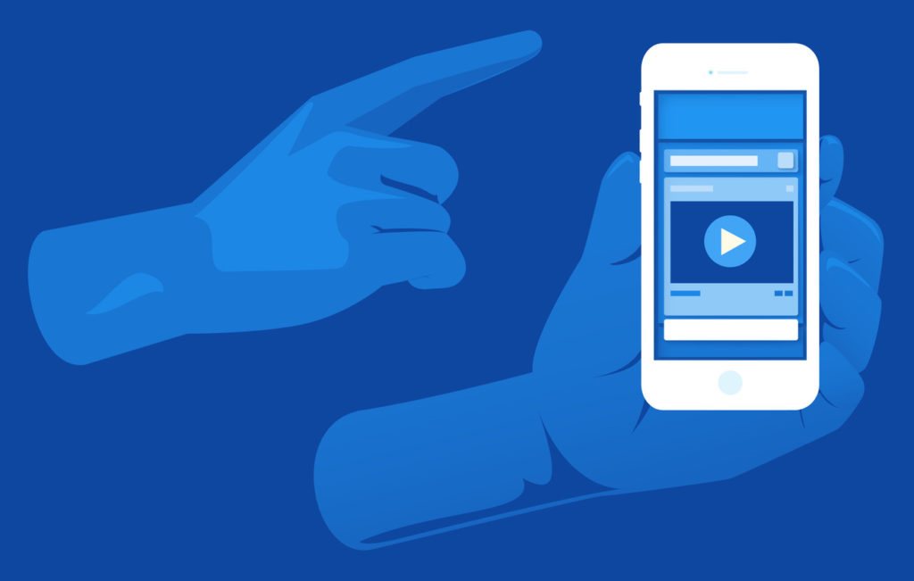 Graphic of hands holding iPhone displaying Facebook video in use Graphic of hands holding iPhone displaying Facebook video in use