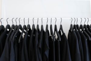 Rack of hangers and black clothes